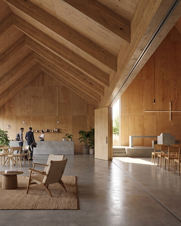Open wooden interior combining café seating and chapel area with high ceiling, exposed beams and large windows.